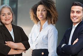 Three business people, arms folded and smiling.