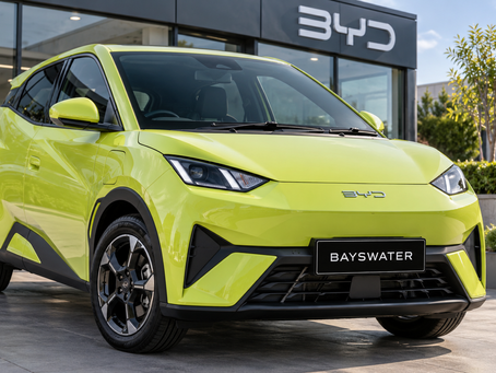 Lime green BYD Dolphin Surf electric vehicle at Bayswater, illustrating vehicle leasing versus finance options in New Zealand.