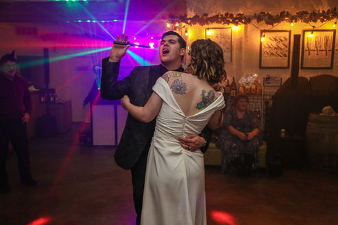 bride and groom dancing together for their reception