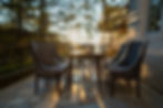 Sunset view at Corner House restaurant in Hotel Simla The Village during golden hour with warm sunlight, overlooking the Shimla Valley.