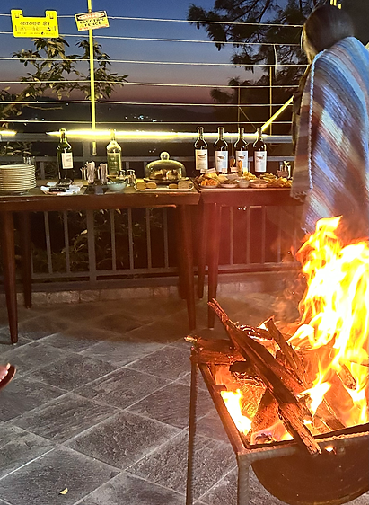 Bonfire at sunset at Simla The Village with panoramic views of the Shimla valley, capturing the serene and warm ambiance