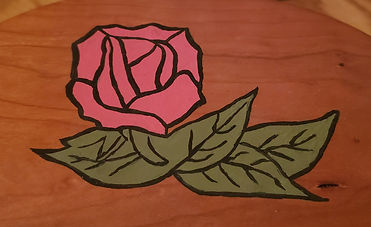oval wooden box with flower etched into top, grandpa made, I painted the flower pink, close up on the flower
