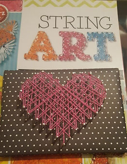 Pink String Art Heart on a black polka dot board