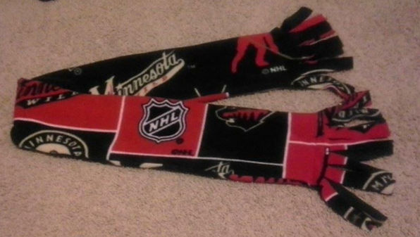 Red and Green Minnesota Wild Fleece fabric turned into a scarf