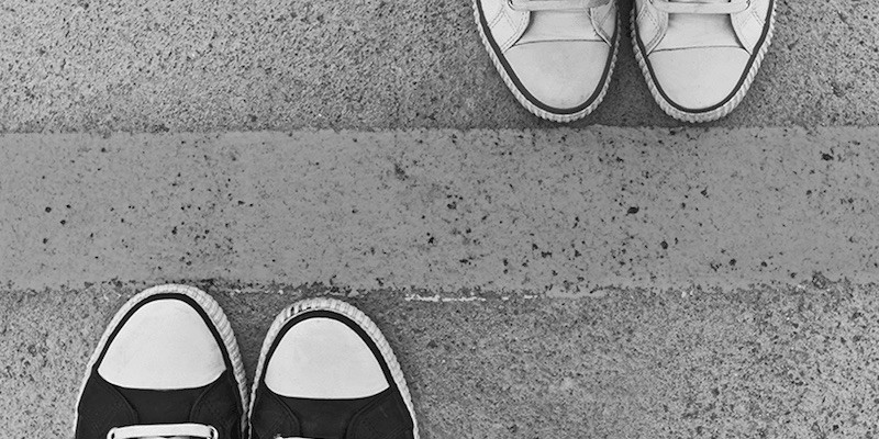 Two sets of feet either side of a line to show boundaries