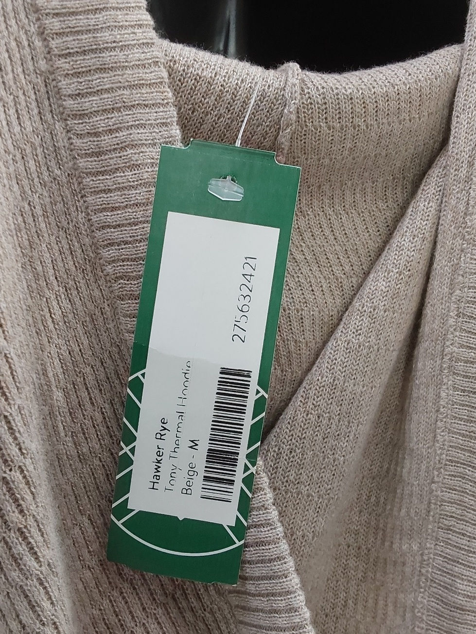 Thumbnail: Beige Hawker Rye thermal hoodie displayed on a hanger with a price tag visible, showcasing the soft texture and casual style,