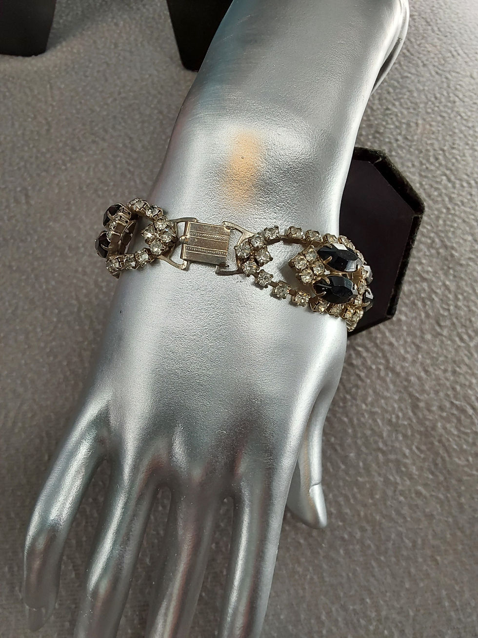 Thumbnail: clasp in warm lighting