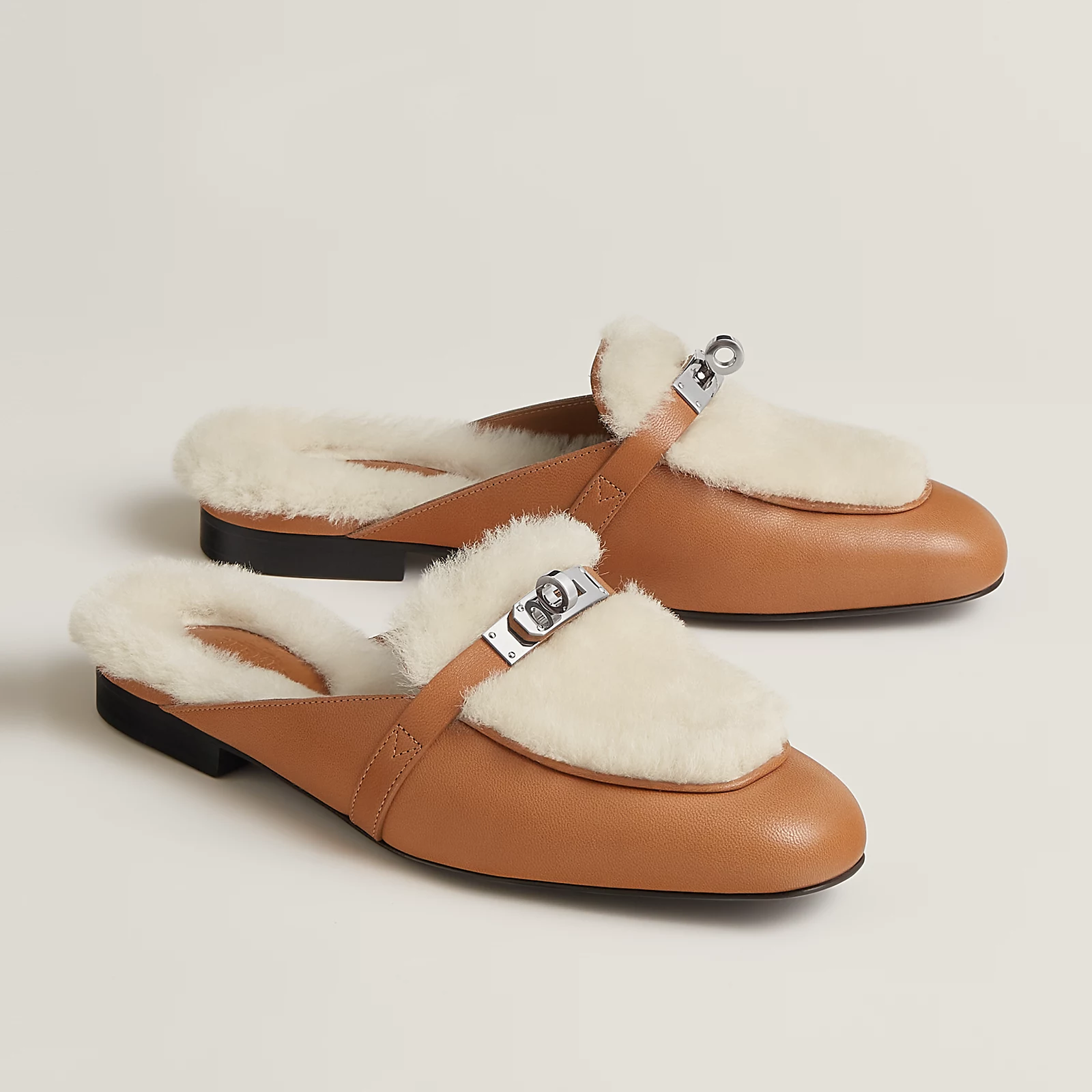 Hermes Oz Mule in goatskin and shearling with iconic Kelly buckle.