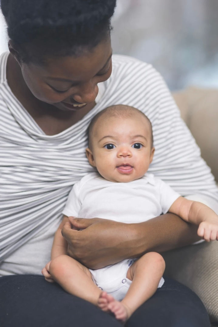 Mother holding a happy baby