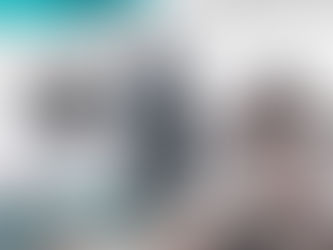 Large industrial CNC lathe machine with metal workpiece in chuck.