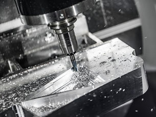 CNC milling machine precision cutting a metal component.