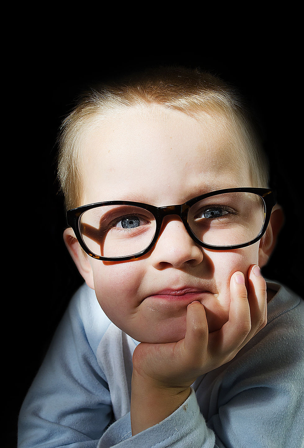 portrait of male child with glasses