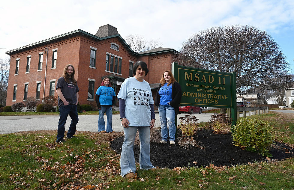 Parents who organized against the anti-LGBTQ rhetoric from growing conservative parents’ organizations stand outside school administration offices in Gardiner, Maine.