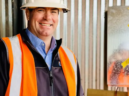 Man with a construction hat on a working site