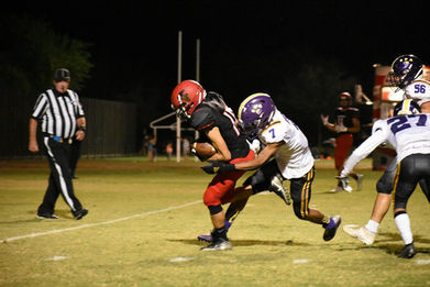 football athlete being tackled