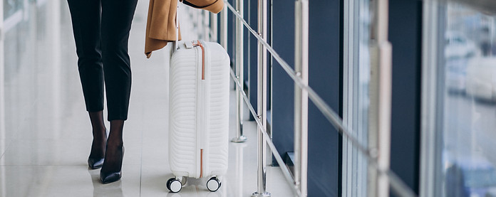 business-woman-terminal-with-travel-bag.