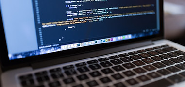Code on Laptop Computer
