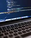 Code on Laptop Computer