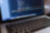 Code on Laptop Computer