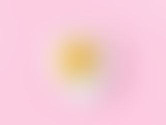 A fried egg on a pink background