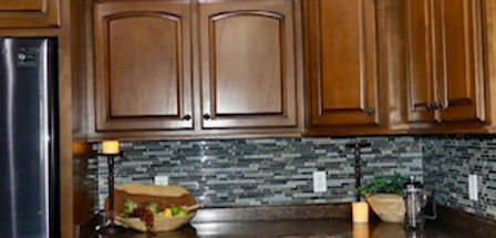 Dark Wood Kitchen Cabinetry with Gray Backsplash Paper