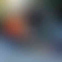 i-Immersion team members dressed in pumpkin costumes next to a Halloween-themed decorated trunk filled with hand-painted pumpkins and spooky decorations at the trunk-or-treat event.