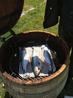 Whole baby salmon in the barrel