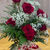 A half dozen red roses in a vase - a testament to love's beauty.