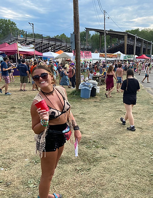 Dani Radigan preparing to host reiki at wellness workshop at a music festival