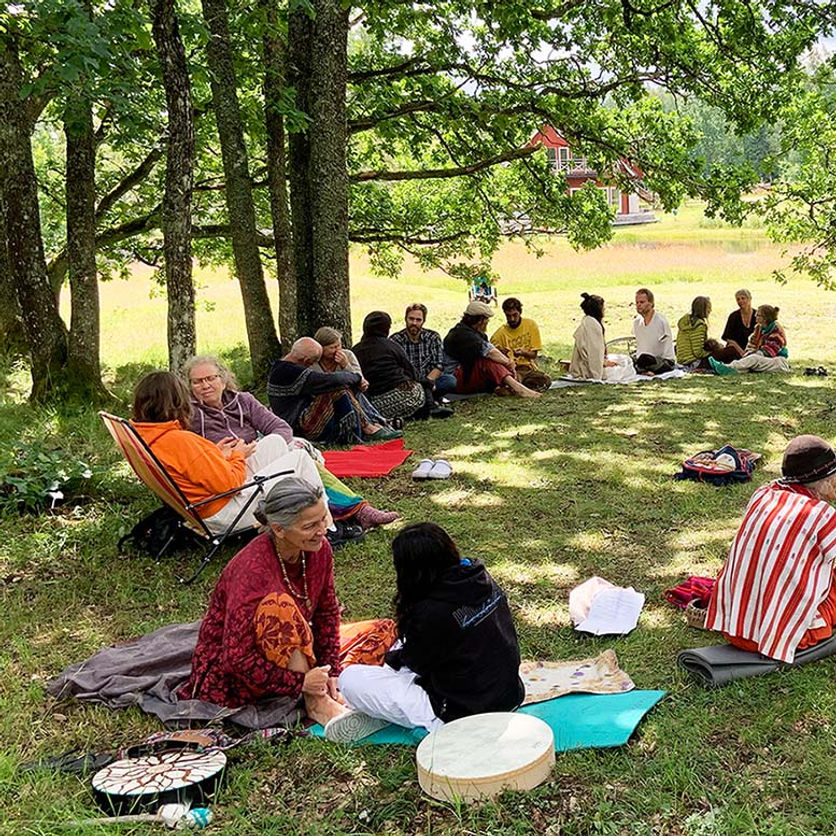 People sitting in circle in nature