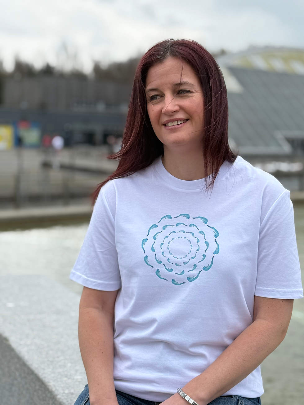 Thumbnail: Woman wearing a white T with one of our underwater female swimmer designs