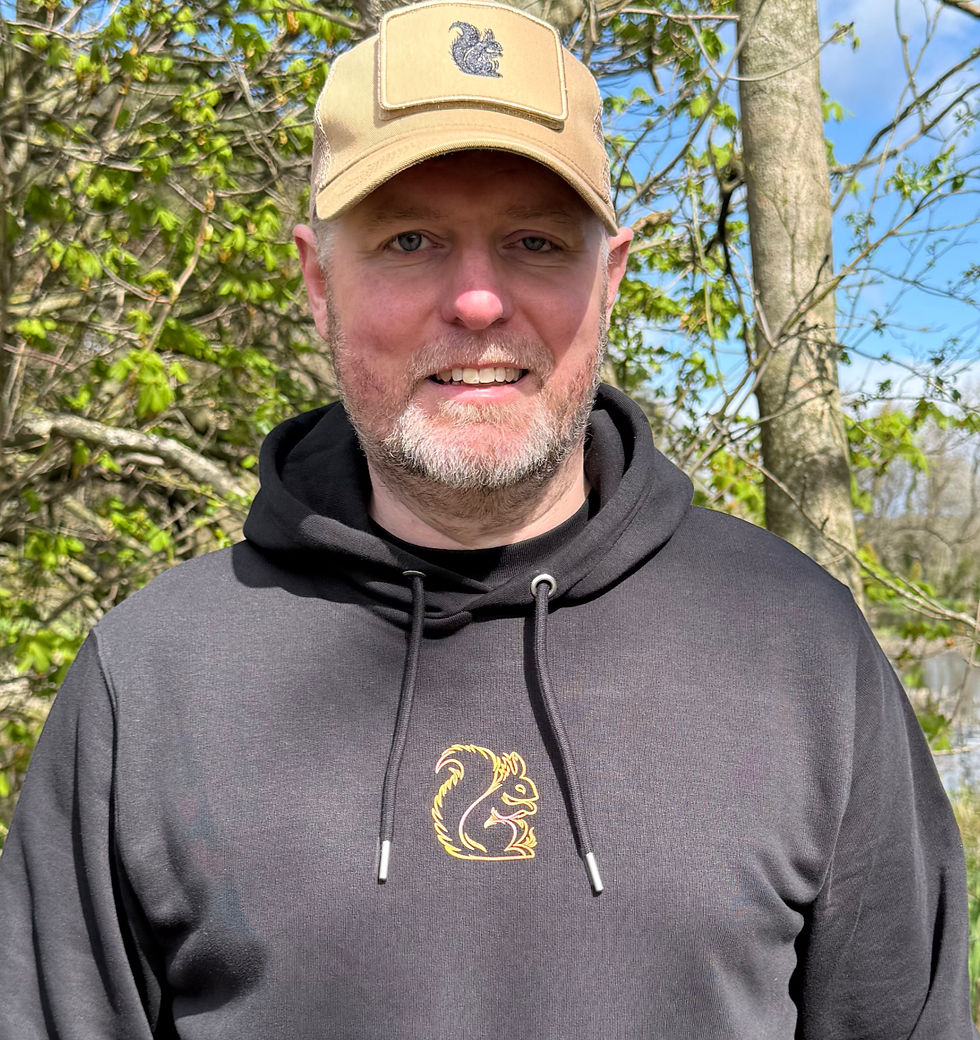 man wearing a Black Black Squirrel Clothing Hoodie and cap
