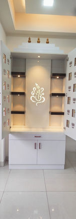 Custom CNC-cut pooja unit with LED-lit shelves and intricate design, maximizing space usage.