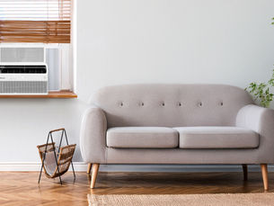Window AC with sofa in room