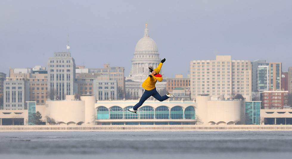 Angelina Huang does a leap in front of the Monona Terrace and Wisconsin State Capitol