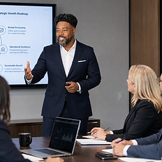 Leaders review change priorities, communication, and next steps around a conference table.