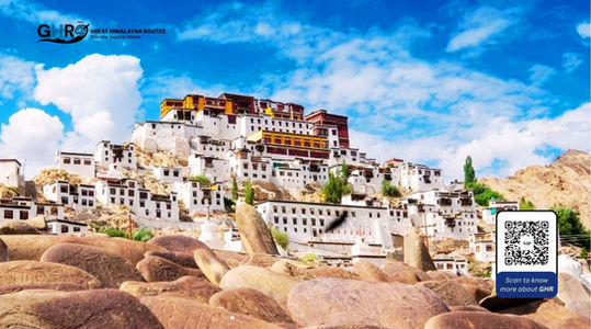 White building under blue sky with text GHR, Scan to know more about GHR, Great Himalayan Routes