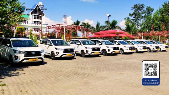 White cars parked with text, Great Himalayan Routes. best tour agency in india