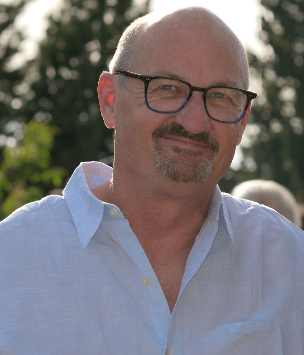 Norman Fox in a blue summer shirt