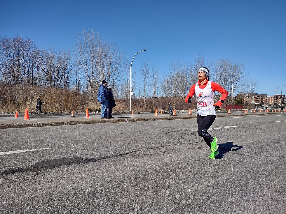 Woman running along a paved road.