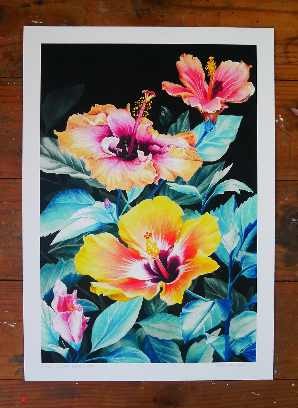 Art print showcasing a beautiful painting of hibiscus flowers set on a charming wooden table.