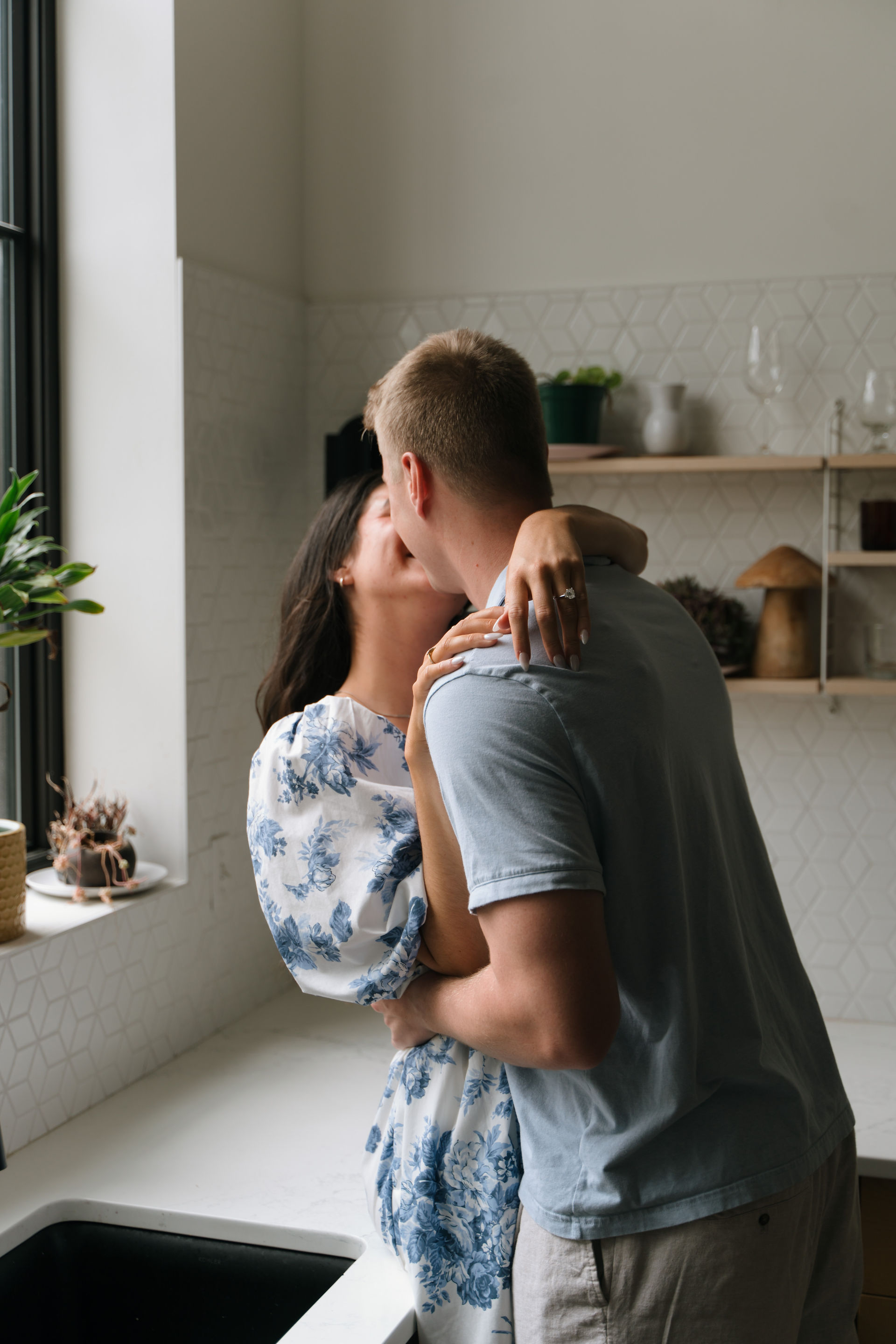 engaged couple in kitchen