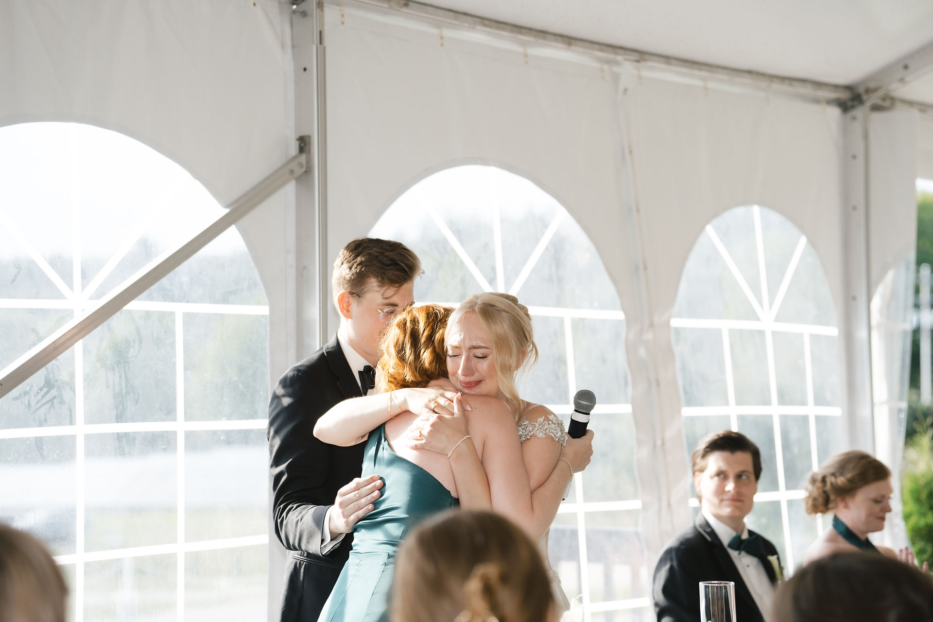 bride hugging maid of honor