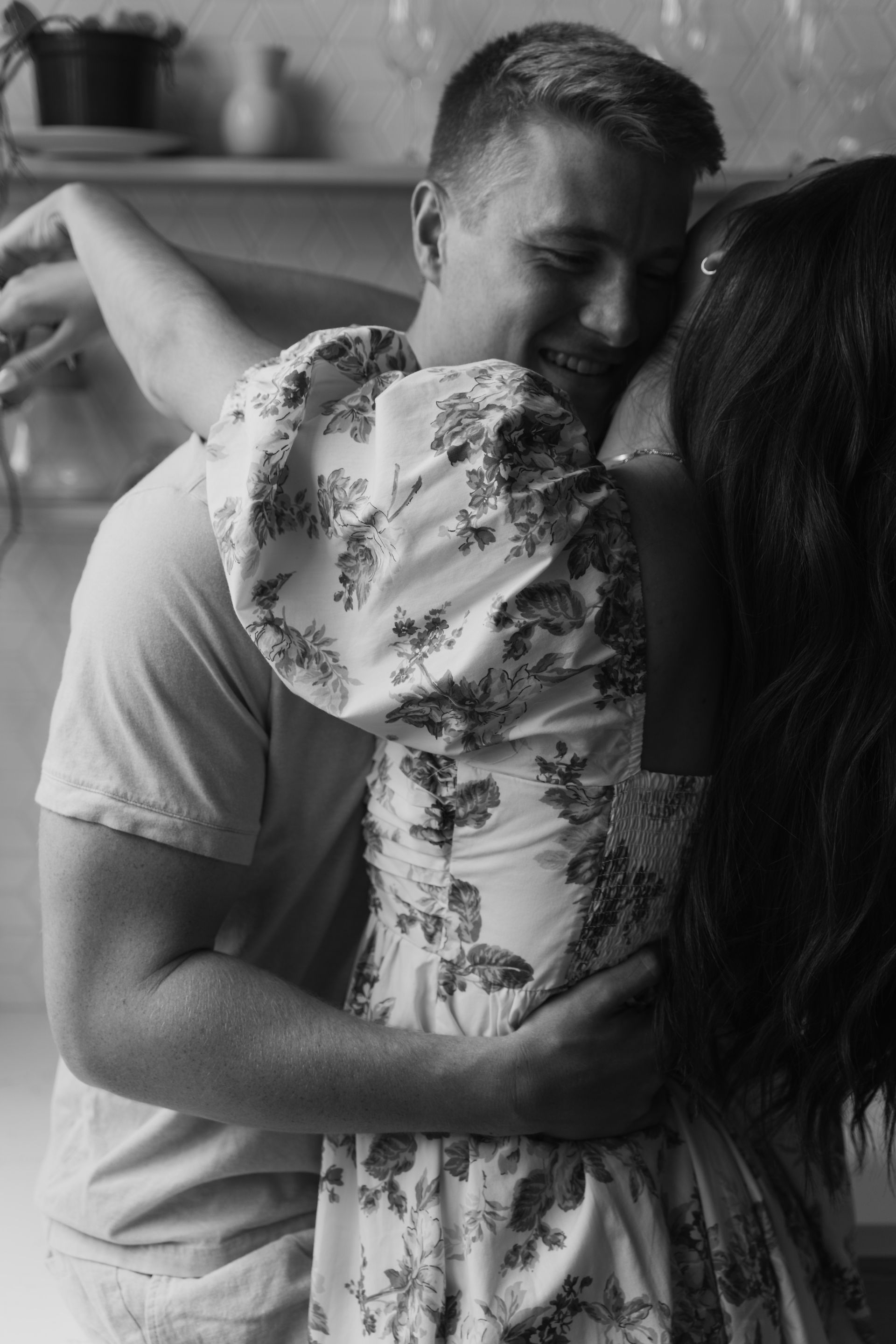 engaged couple in kitchen