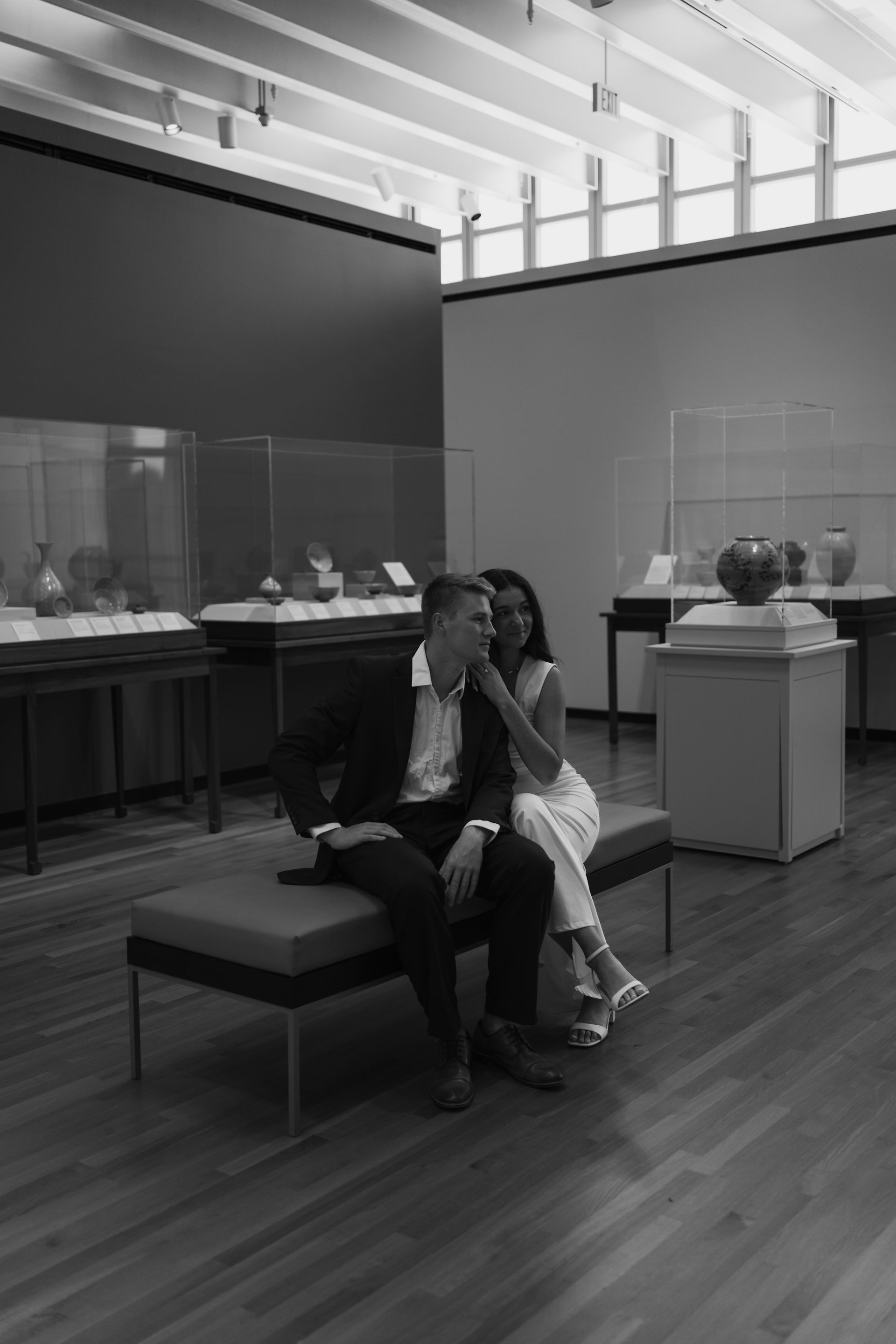 engaged couple in art gallery