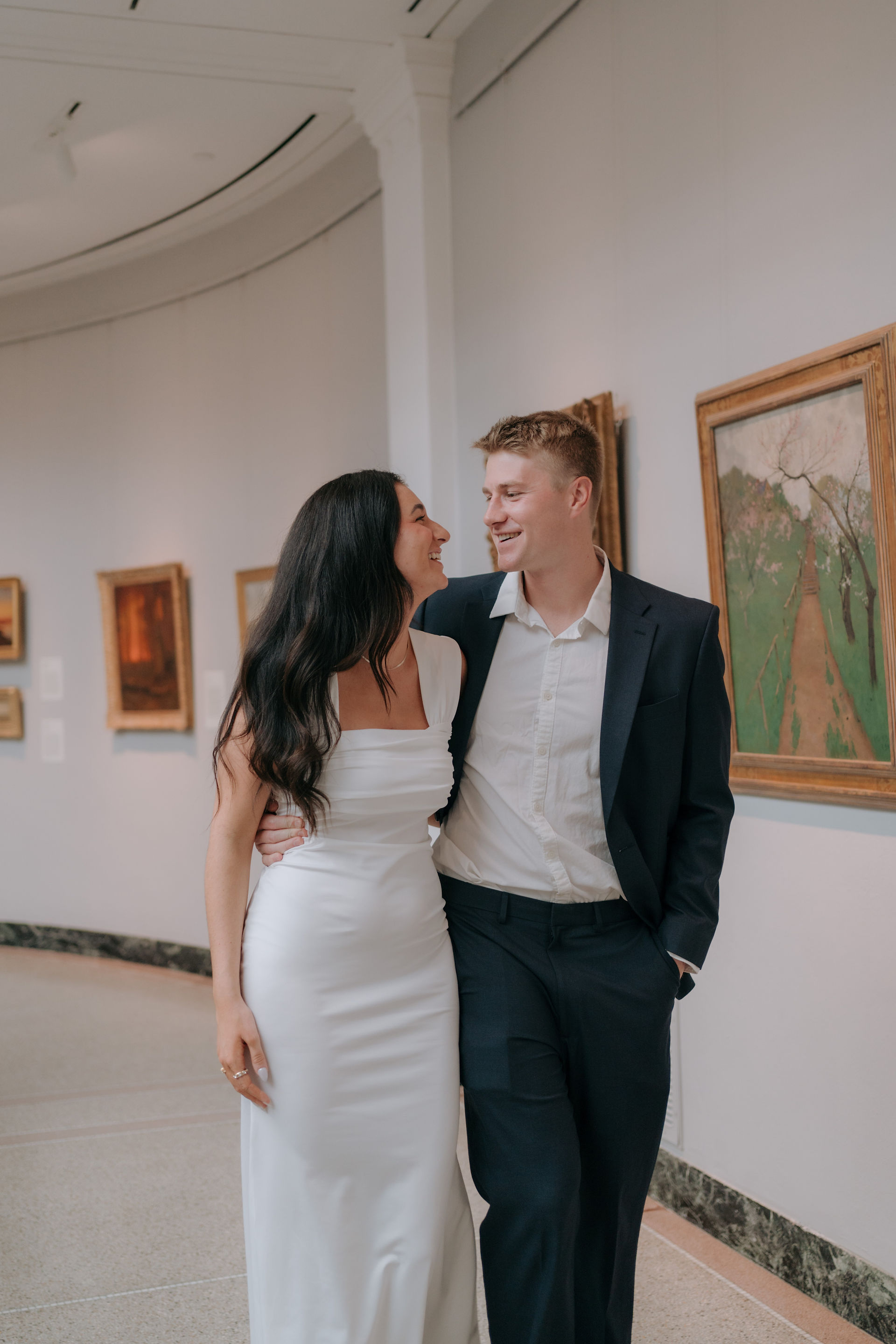 engaged couple in art gallery