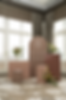 Elegant seating chart with flowers on brown stands in a room with large windows and patterned carpet. "FIND YOUR SEAT" text visible.