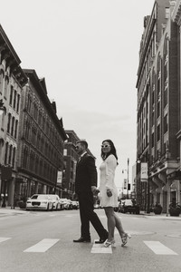 couple walking between buildings