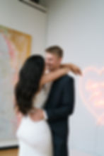 engaged couple in art gallery