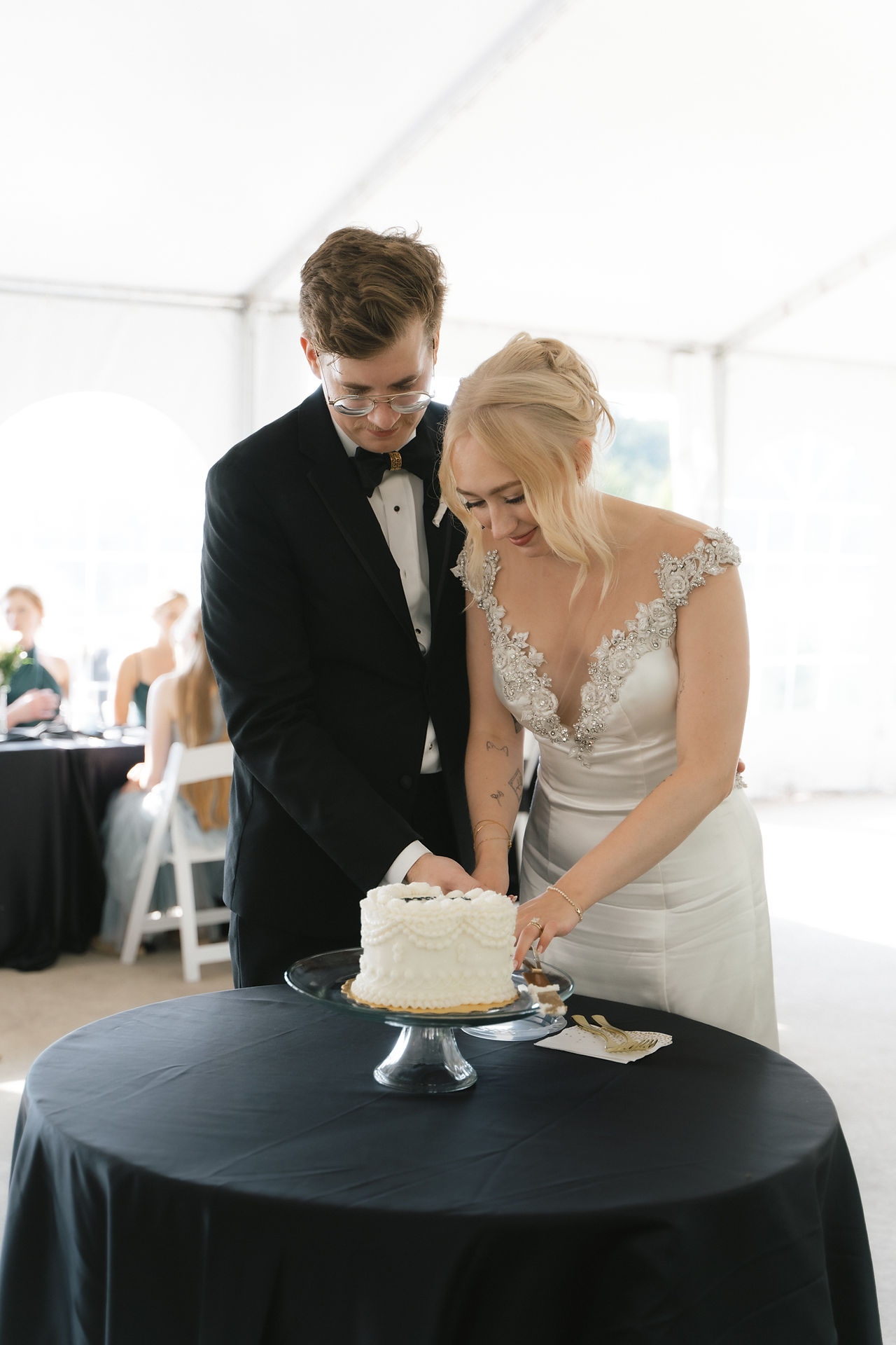 bride and groom cutting cake